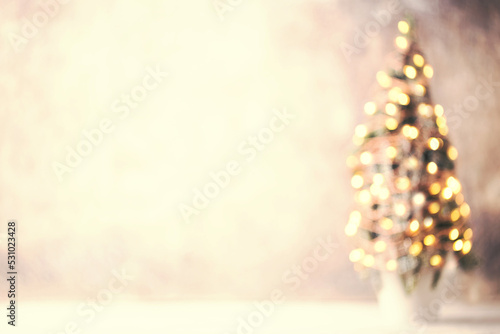 Defocused christmas tree silhouette with blurred lights.