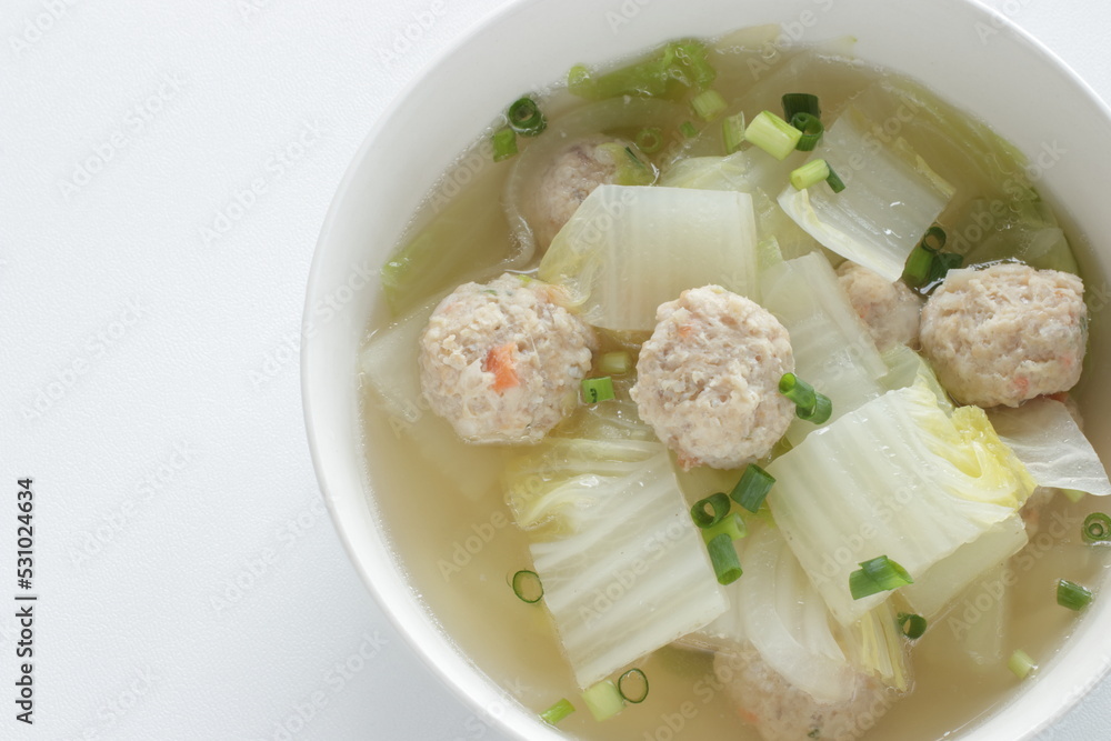 Chicken meat ball and Chinese cabbage soup in white bowl for winter hot pot food image Chicken meat ball and Chinese cabbage soup in white bowl for winter hot pot food image