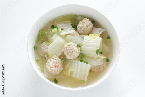 Chicken meat ball and Chinese cabbage soup in white bowl for winter hot pot food image