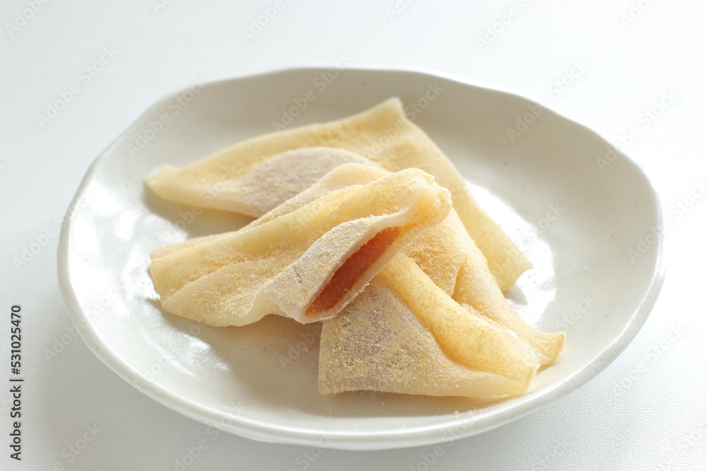 Japansese sweet food, Kyoto sweet potato paste in sticky rice in triangle shape for regional confectionery Japansese sweet food, Kyoto sweet potato paste in sticky rice in triangle shape for regional confectionery