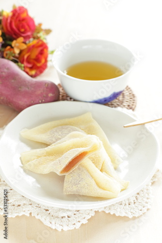 Japansese sweet food, Kyoto sweet potato paste in sticky rice in triangle shape for regional confectionery  photo