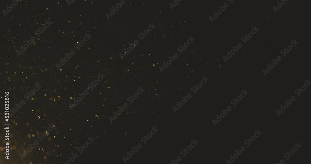 Shot of real dust particles floating in the air. Dust Particles Background.  slow motion shot, Use blending mode (screen)
