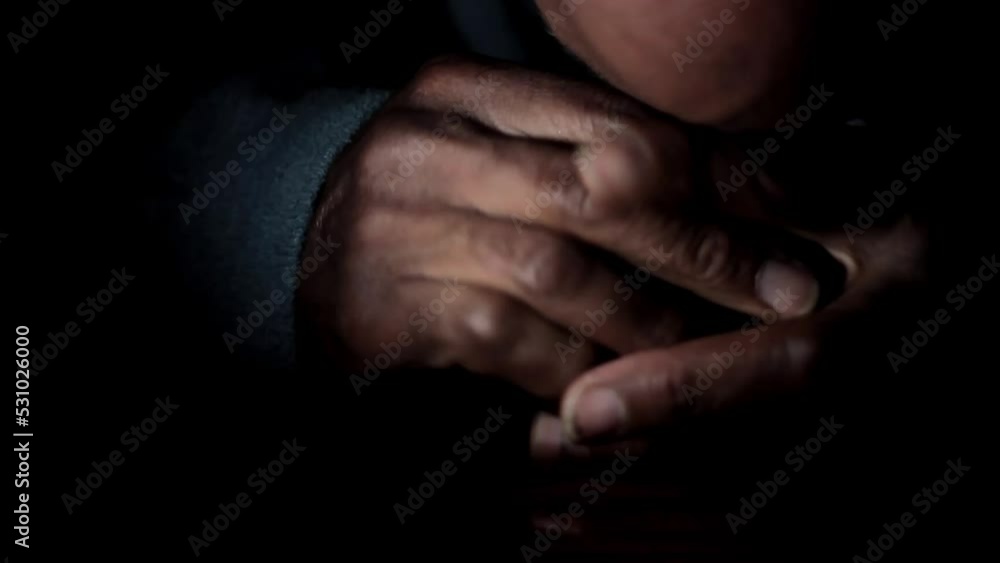 man praying to god with hands together Caribbean man praying with black background stock footage man praying to god with hands together Caribbean man praying with black background stock footage