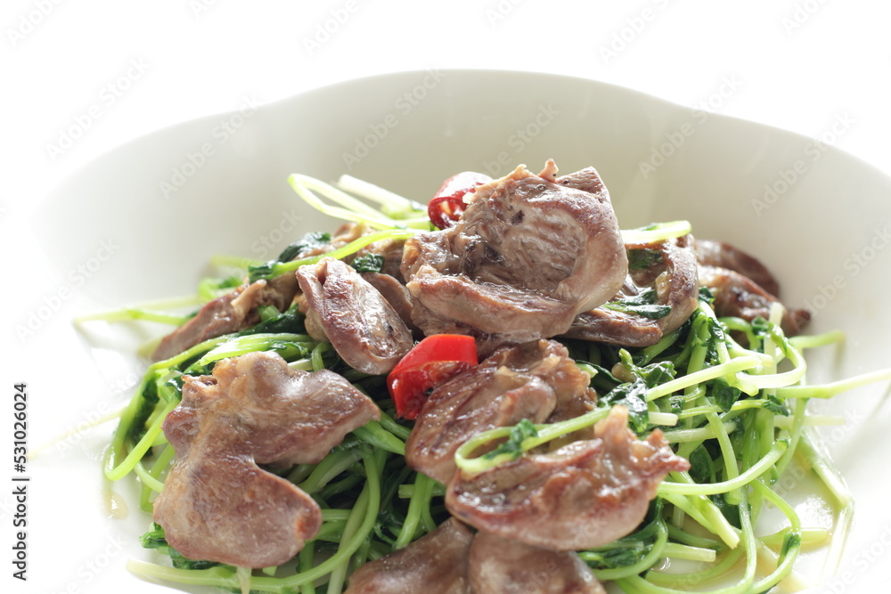Chinese cuisine, chicken gizzard and pea sprout stir fried Chinese cuisine, chicken gizzard and pea sprout stir fried