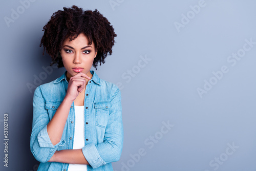 Photo of clever lady decide solution touch chin finger hand wear stylish denim clothes empty space isolated on gray color background