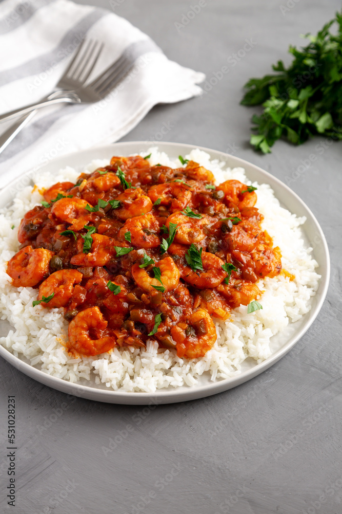Homemade Cuban Shrimp Creole on a Plate on a gray surface, side view. Homemade Cuban Shrimp Creole on a Plate on a gray surface, side view.