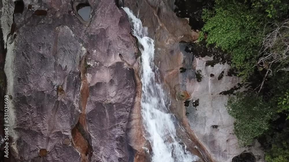 Aerial shot of the Guaratuba waterfall, zooming out from a close up to a wide shot. Aerial shot of the Guaratuba waterfall, zooming out from a close up to a wide shot.