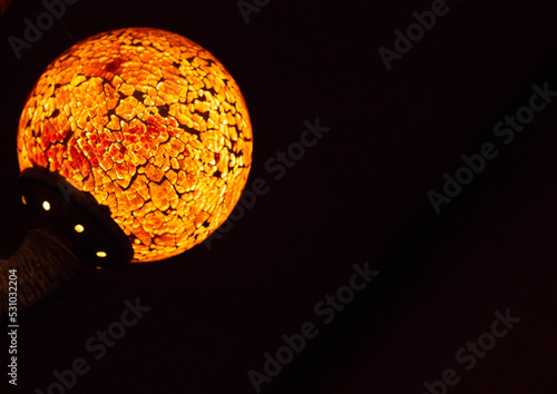 Round shape lamp with beautiful orange lights.