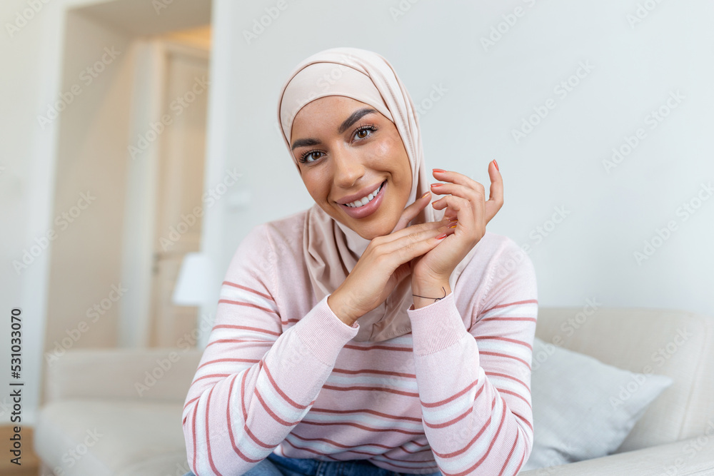 Portrait young muslim woman in headscarf smile.Happy moment concept. Headshot of a beautiful Muslim female model in a casual wear and hijab Portrait young muslim woman in headscarf smile.Happy moment concept. Headshot of a beautiful Muslim female model in a casual wear and hijab