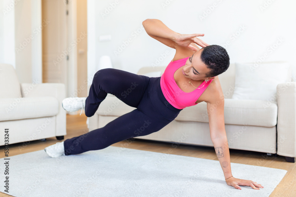 Warming Up Before Workout. Smiling Sporty Black Woman Training At Home Or Fitness Club Studio, Beautiful Female Stretching Legs After Exercises On Mat Warming Up Before Workout. Smiling Sporty Black Woman Training At Home Or Fitness Club Studio, Beautiful Female Stretching Legs After Exercises On Mat
