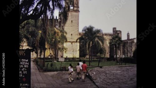 Taxco de Alarcon, Mexico june 1975: panoramic city view and Cathedral of Taxco photo