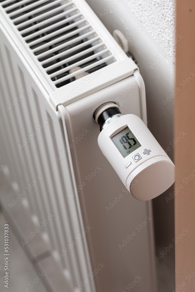 Woman's hand adjusting temperature. Woman's hand adjusting temperature.