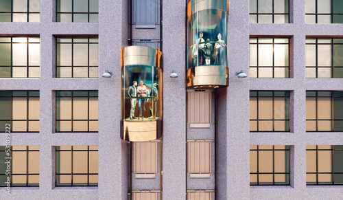 People move in the outdoor elevators of a multi-storey municipal building