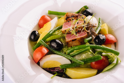 Nicoise salad with tuma and tomato photo