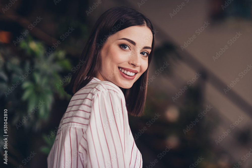 Profile portrait of pretty positive lady toothy smile wear striped shirt modern office building indoors Profile portrait of pretty positive lady toothy smile wear striped shirt modern office building indoors
