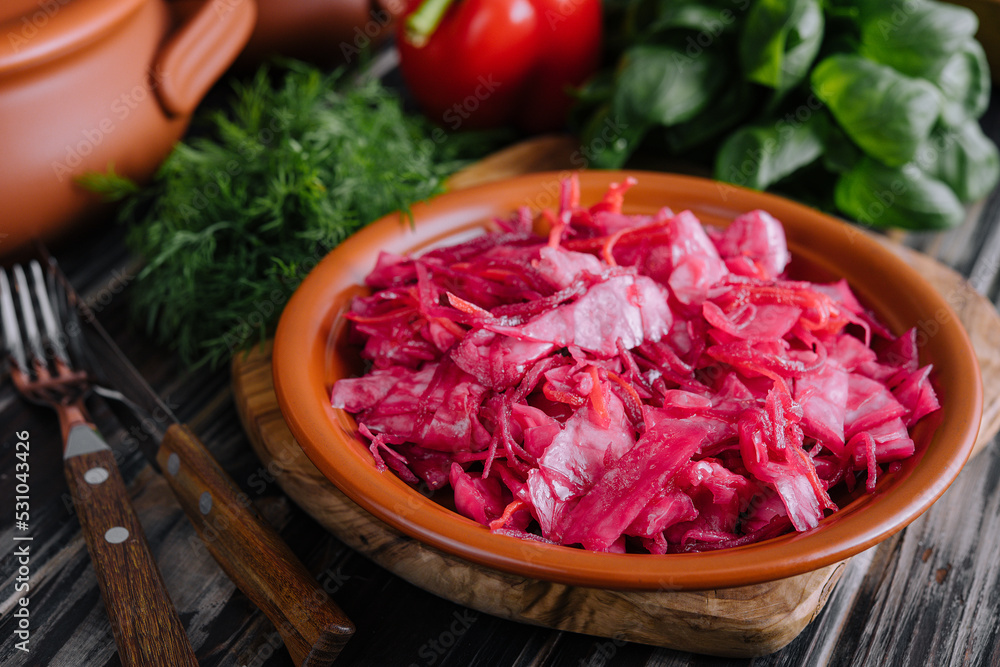 Salad with cabbage and beetroot on wooden table Salad with cabbage and beetroot on wooden table