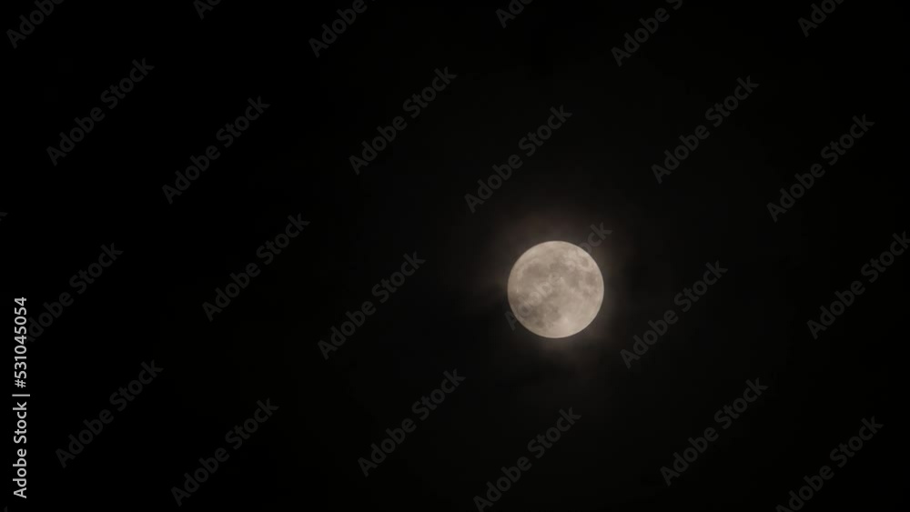 Clouds passing by moon at night. Full moon at night with clouds real time. Clouds passing by moon at night. Full moon at night with clouds real time.