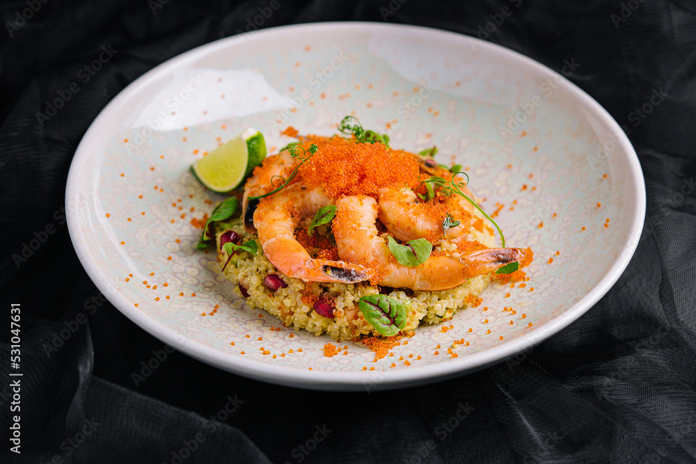 Couscous with vegetables and shrimp under red caviar Couscous with vegetables and shrimp under red caviar