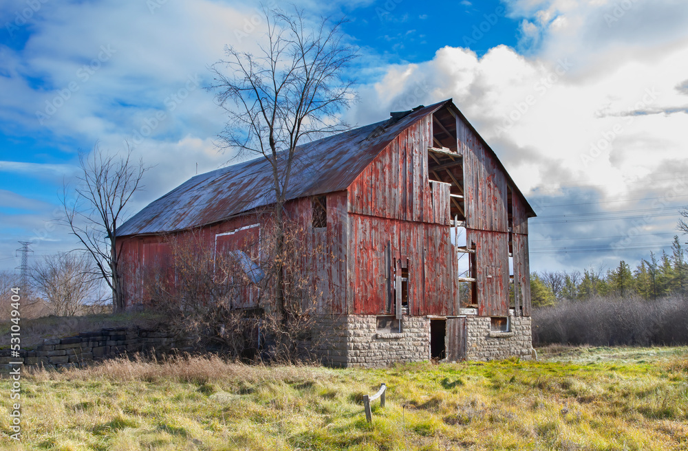 Old abandoned red barn along highway 16 near Ottawa, Canada