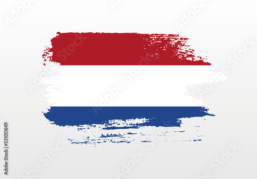 Modern style brush painted splash flag of Netherlands with solid background
