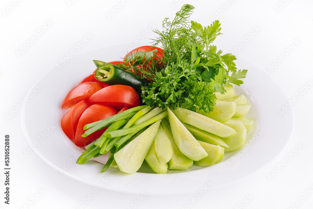 Vegan plate of fresh sliced cucumbers, green onions and cherry tomatoes Vegan plate of fresh sliced cucumbers, green onions and cherry tomatoes