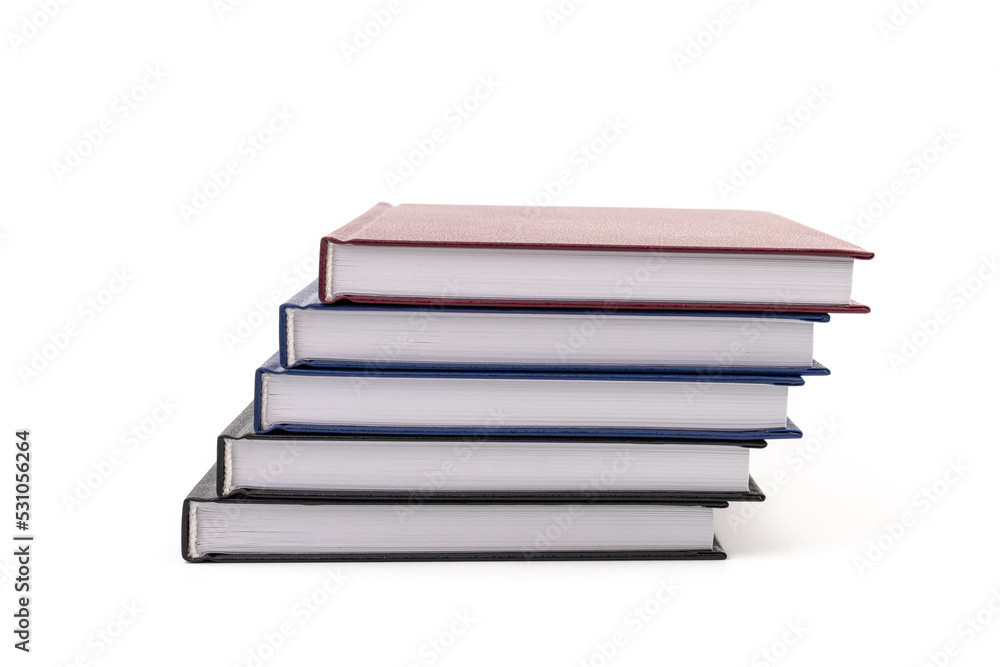 Stacked hardcover notebooks on white background. Education business concept. Stacked hardcover notebooks on white background. Education business concept.