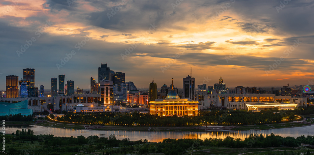 Fototapeta premium The central part of the capital of Kazakhstan, the city of Astana, and the residence of the President under the disturbing sky at evening twilight