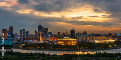 The central part of the capital of Kazakhstan, the city of Astana, and the residence of the President under the disturbing sky at evening twilight