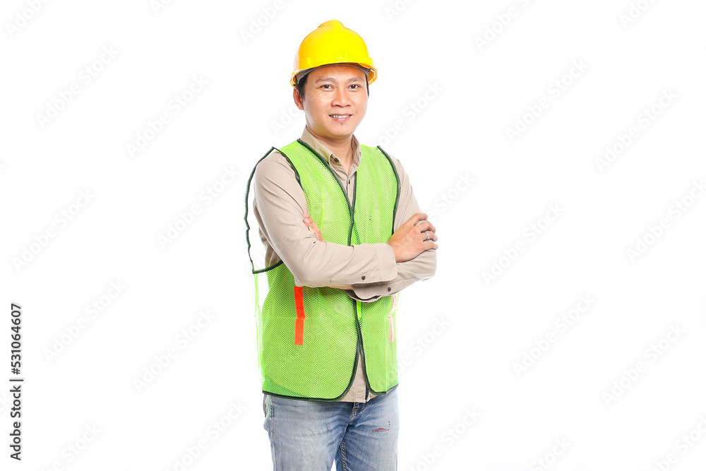 Portrait of young Asian engineer male worker in protective safety uniform helmet standing isolated on white background.