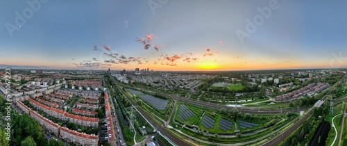 Aerial panorama with view of the skyline in The Hague, Netherlands, at sunset above the town of Voorburg photo