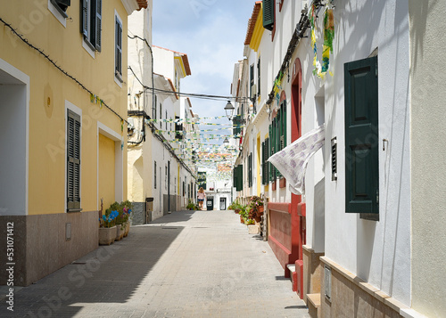 Back street of Menorcan village in summer photo