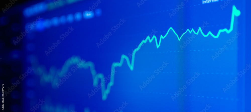 Stock market upwards chart on the screen. Selective focus.Low angle.Banner,advertisement. Stock market upwards chart on the screen. Selective focus.Low angle.Banner,advertisement.