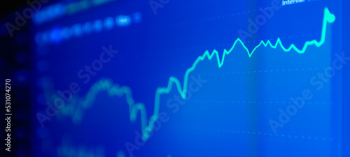 Stock market upwards chart on the screen. Selective focus.Low angle.Banner,advertisement.