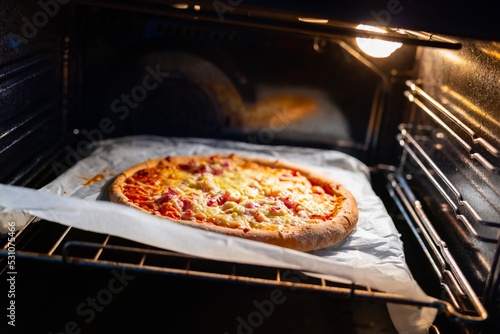 Home made pizza in the oven ready to be taken out