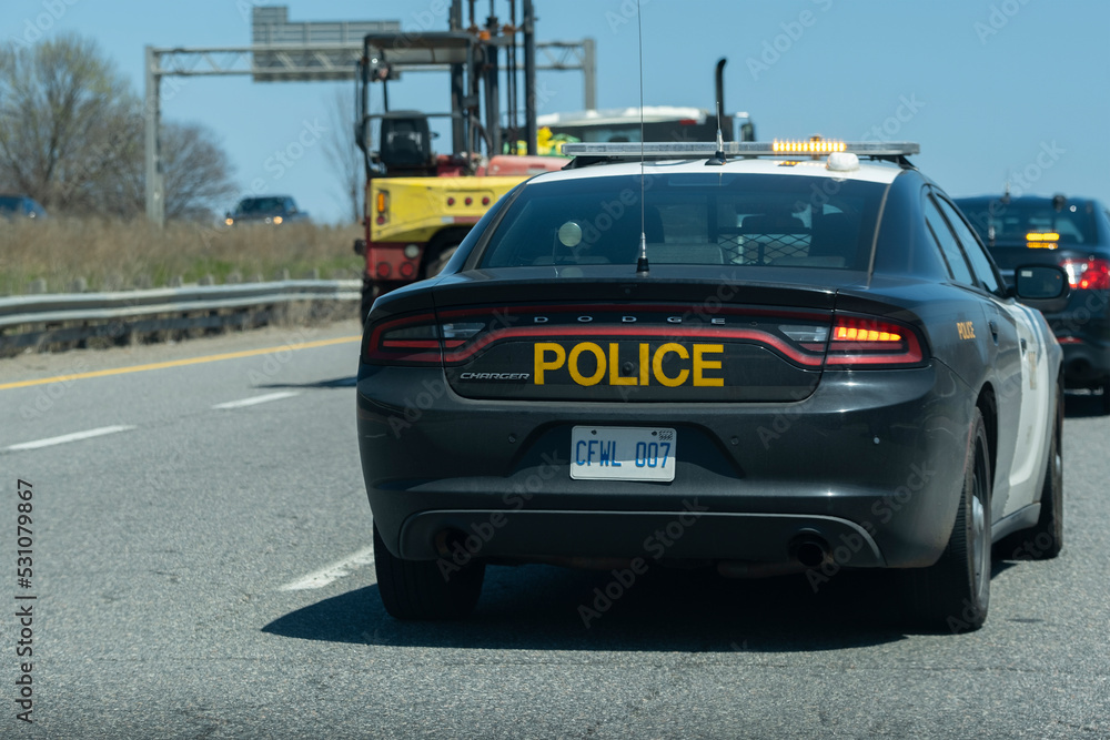 Close View Of Opp Dodge Charger Police Cruiser Interceptor Following A Car On The Highway