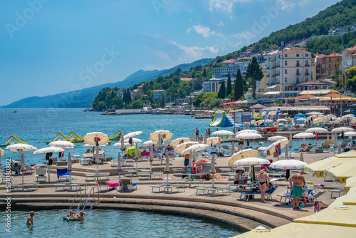 View of restaurants and sunshades on The Lungomare promenade in the town of Opatija, Opatija, Kvarner Bay, Croatia photo