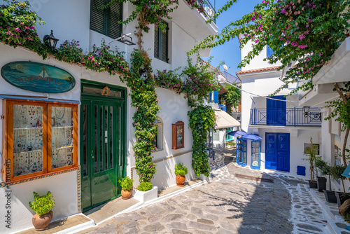 View of narrow whitewashed street in Skiathos Town, Skiathos Island, Sporades Islands, Greek Islands, Greece photo