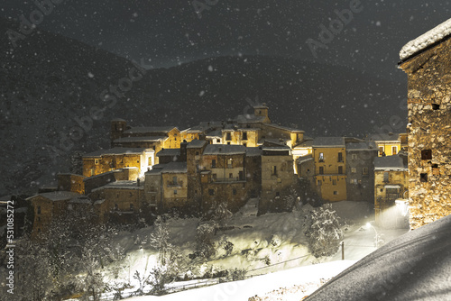 Winter view of the illuminated medieval village of Cansano during snowfall, Cansano, L'Aquila provice, Abruzzo, Italy photo