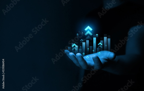 Businessman drawings growth graph of business. Successful business, growth strategy and achieving goals with the rising arrow. Business strategy development and growing growth plan. 