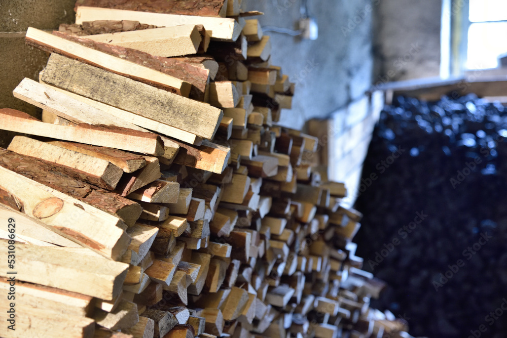 Wroclaw, Poland - serious problem with coal in 2022. Limited resources cause by war in Ukraine and sanctions.Wood and coal in basement. Wroclaw, Poland - serious problem with coal in 2022. Limited resources cause by war in Ukraine and sanctions.Wood and coal in basement.