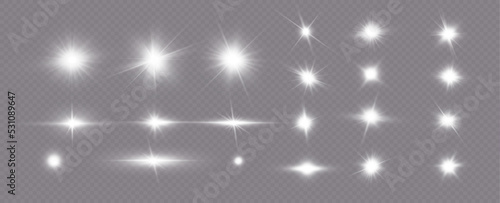White sparkles.Bright star.Glow burst.Rays of the sun on a transparent background.