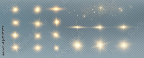 Golden particles of light. Golden light. Light flare.Stars isolated on transparent background.