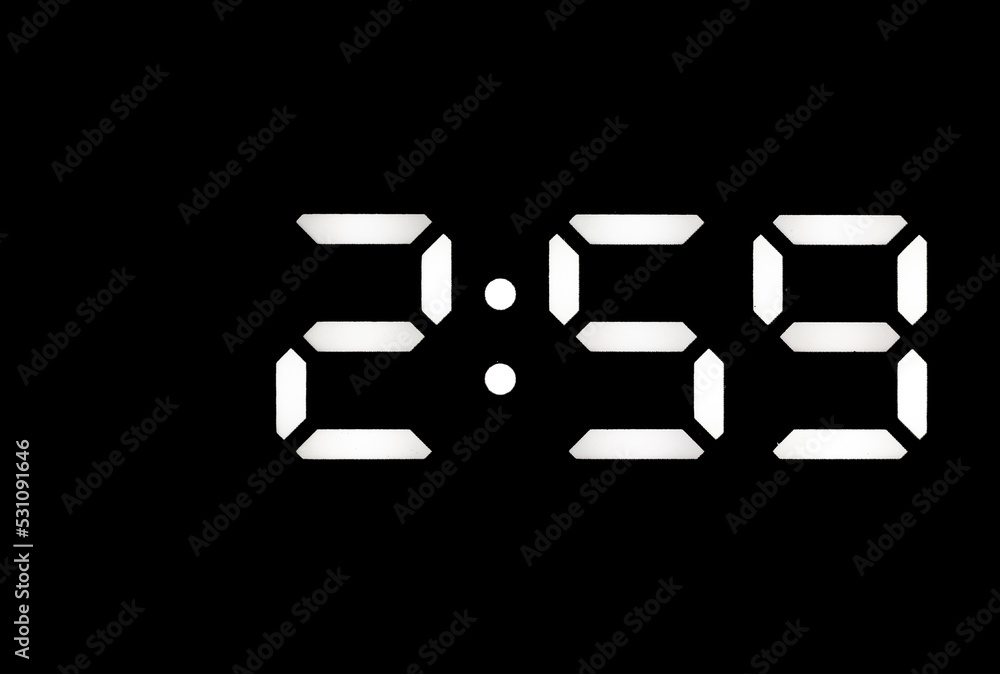 Real white led digital clock on black background Real white led digital clock on black background