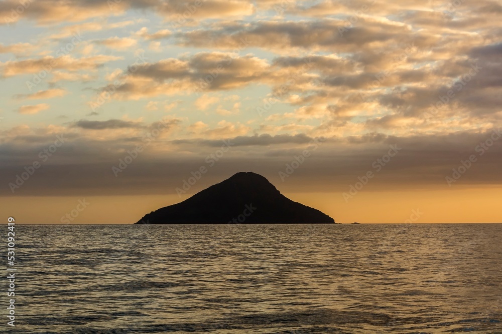 Monte de Trigo island and horizon at sunset. Environmental reserve in the So Sebastio Channel, Brazil
