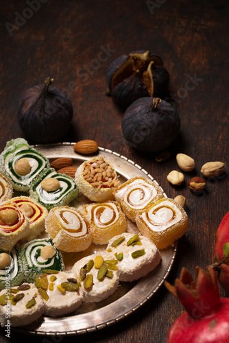 Photography oriental sweets Lokum with nuts and pomegranate and figs