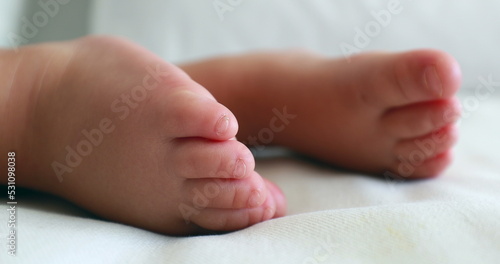 Baby feet and toes close-up while sleeping. One year old toddler infant two geet closeup