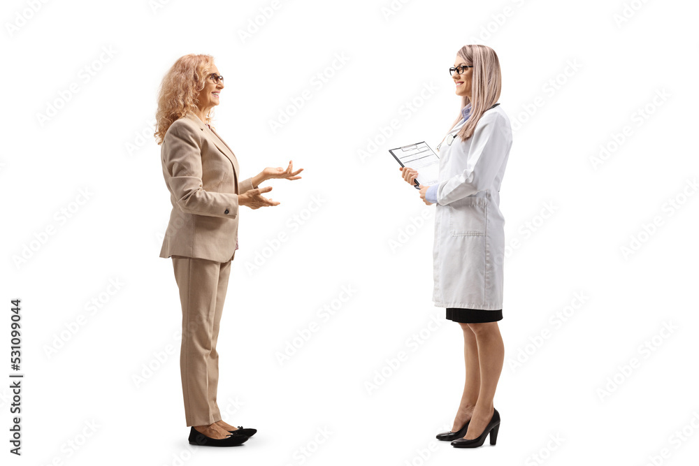 Full length profile shot of a mature female patient and a female doctor having a conversation Full length profile shot of a mature female patient and a female doctor having a conversation