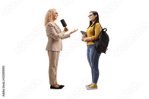 Female reporter interviewing a female student