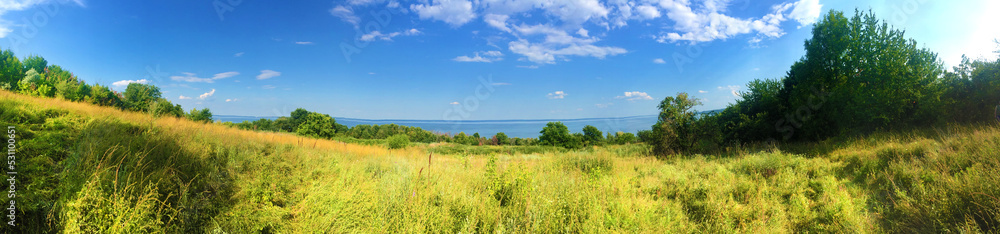 Beautiful landscape of Kaniv Reservoir shore, Ukraine, in sunny day with bright blue sky