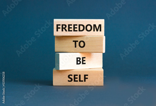 Freedom to be self symbol. Concept words Freedom to be self on wooden blocks on a beautiful grey table grey background. Business, psychological freedom to be self concept.